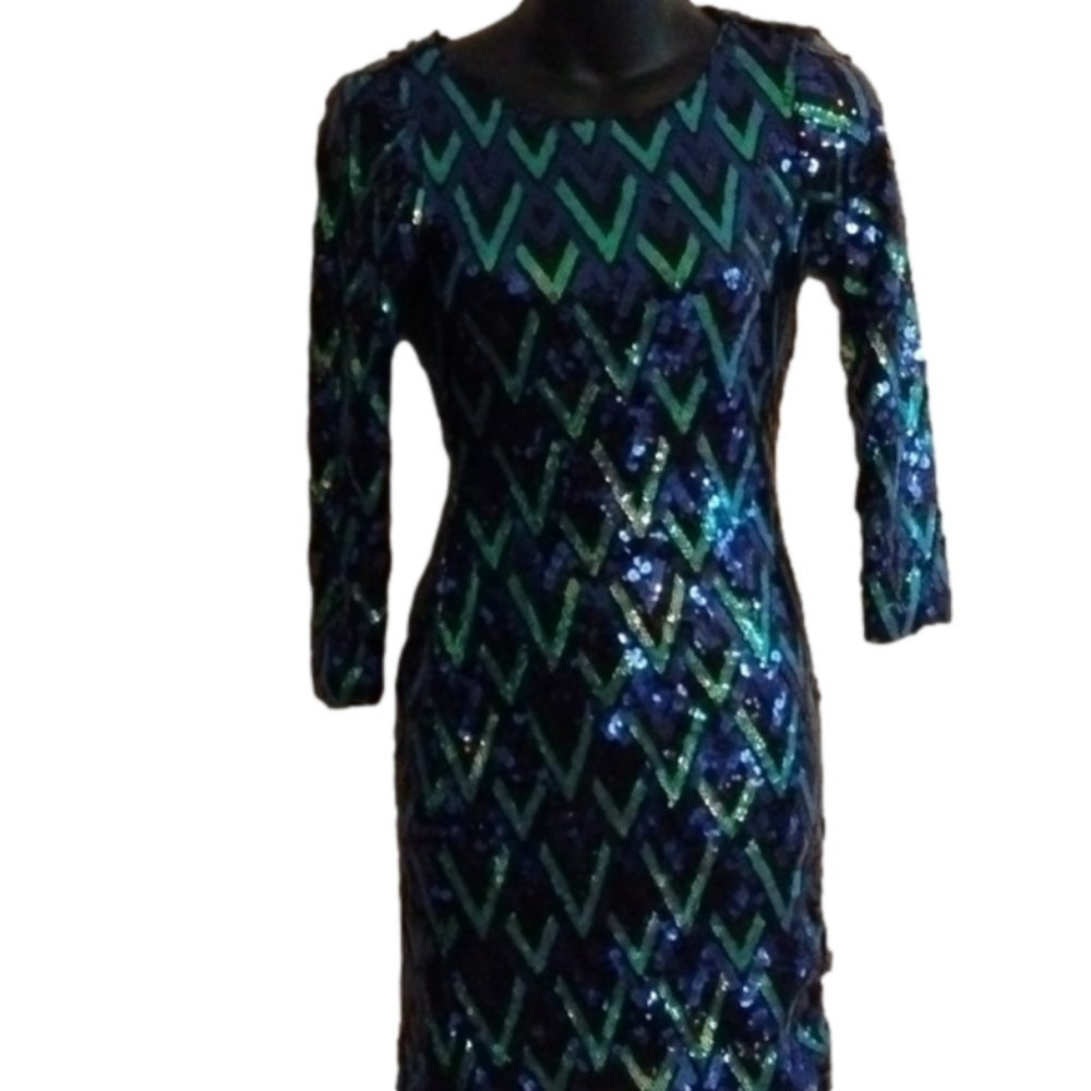 Beautiful blue sequined cutout form fitting dress by Charlotte Russe.Size small.